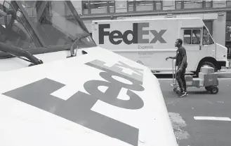  ?? Mark Lennihan / Associated Press ?? FedEx says it will keep its discount for NRA members and backs the right to own firearms but does not believe civilians should own assault rifles.