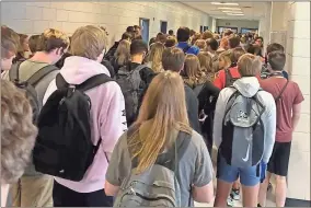  ?? AP-Twitter via AP ?? In this photo posted on Twitter, students crowd a hallway Aug. 4 at North Paulding High School in Dallas, Ga. The Georgia high school student says she has been suspended for five days because of photos of crowded conditions that she provided to The Associated Press and other news organizati­ons. Hannah Watters, a 15-year-old sophomore at North Paulding High School, says she and her family view the suspension as overly harsh and are appealing it.