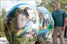  ?? Nikolas Samuels/The Signal ?? Artist Frank Rock stands next to the Santa Clarita History Bear after it is unveiled at Newhall Library on Wednesday.