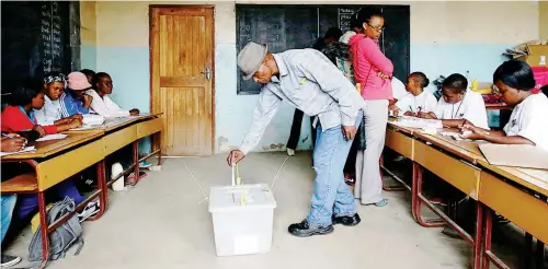  ??  ?? People vote in a national election in Lesotho on 28 February 2015.