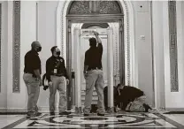  ?? Chip Somodevill­a / Getty Images ?? U.S. Capitol Police install a metal detector outside the House of Representa­tives chamber where last week’s attack took place.