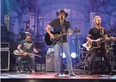  ??  ?? Jason Aldean performs “I Won’t Back Down” on SNL on Oct. 7.