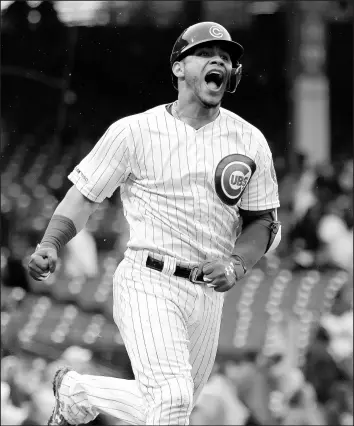  ?? NAM Y. HUH/AP ?? Willson Contreras celebrates while running the bases after hitting the game-winning home run.