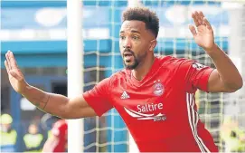  ??  ?? Shay Logan celebrates his winner against Ross County.