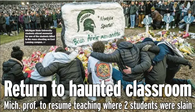  ?? AP ?? Michigan State University students attend memorial for one of the students killed in the mass shooting on East Lansing campus.