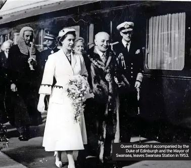  ?? ?? Queen Elizabeth II accompanie­d by the Duke of Edinburgh and the Mayor of Swansea, leaves Swansea Station in 1953.