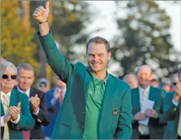  ??  ?? Masters champion Danny Willett, of England, gives a thumbs up after winning the Masters golf tournament Sunday.
"1 1)050