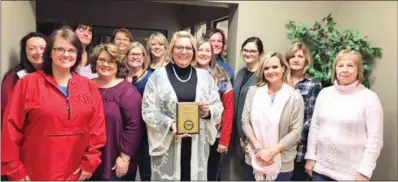  ?? SUBMITTED PHOTO ?? Haymond Insurance in Searcy won the overall award for the most food collected in the Deck the Box holiday food drive sponsored by the Community Action Program for Central Arkansas. Pictured, front row, from left, are Denise Drye, Sharon Spencer, Cindy Dixon with plaque, Nicole Warden and Debbie Cox; second row, Vanessa Reynolds, Lisa Kendrick, Amber Finley, Rikki Yarbrough and Gina Doughty; and back row, Ellen Holden, Denise Morton, Patti Crump and Samantha Huffman.