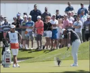  ?? MARK LENNIHAN — THE ASSOCIATED PRESS ?? Brooks Koepka hits from the first fairway of the final round in the Northern Trust tournament at Liberty National Golf Course on Aug. 11 in Jersey City, N.J.