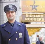  ??  ?? Officer Ricardo DiCandia stands outside Richard Rodgers Theatre, where he helped tourists who’d been waiting for days to see the hit "Hamilton."