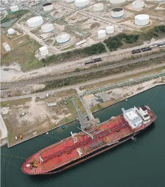  ?? EDDIE SEAL/BLOOMBERG FILES ?? A Chevron Corp. tanker loads oil in Corpus Christi, Texas. Access to the Gulf would bring relief to long-suffering Canadian oil and gas producers, Claudia Cattaneo writes.