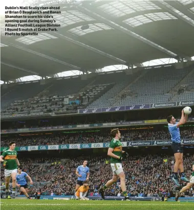  ??  ?? Dublin’s Niall Scully rises ahead of Brian Ó Beaglaoich and Ronan Shanahan to score his side’s opening goal during Sunday’s Allianz Football League Division 1 Round 5 match at Croke Park. Photo by Sportsfile
