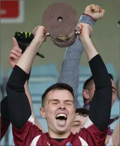  ??  ?? Jubilant St. Martin’s captain Luke White lifts the cup.