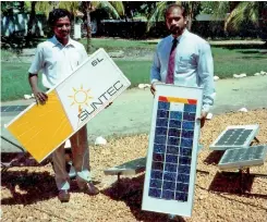  ??  ?? File picture of the solar power pioneer (right) with a Suntec panel in the mid-1980s.