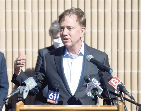  ?? H John Voorhees III / Hearst Connecticu­t Media ?? Gov. Ned Lamont speaks after visiting a COVID-19 vaccinatio­n clinic for staff of local child care providers at Rodgers Park School in Danbury earlier this month.