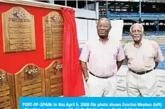  ??  ?? PORT-OF-SPAIN: In this April 5, 2008 file photo shows Everton Weekes (left) attending a ceremony with Andy Gantaume in front of display honouring Frank Worrell in Port-Of-Spain.