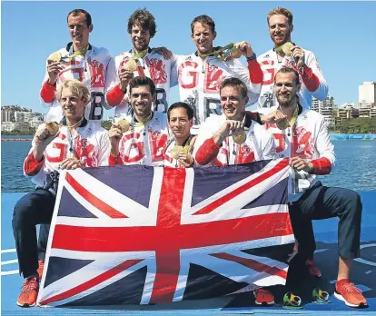 ??  ?? Great Britain’s men’s eight pose with their golds in Rio yesterday.