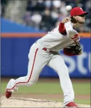  ?? FRANK FRANKLIN II — THE ASSOCIATED PRESS ?? The Phillies’ Aaron Nola, pitching against the Mets last Thursday in New York, is expected to miss one or two starts due to back soreness, according to Phillies general manager Matt Klentak.