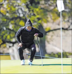  ?? Ryan Kang The Associated Press ?? Tiger Woods was bundled up for a cold pro-am Wednesday at Riviera, a course he has played more than any other on the PGA Tour without a win.