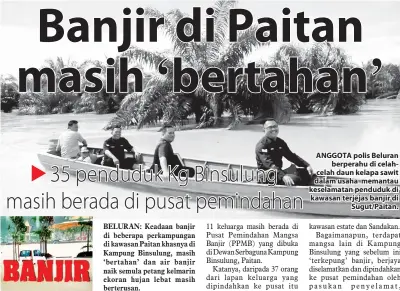  ?? Oleh SALMAN ABADI ?? ANGGOTA polis Beluran berperahu di celahcelah daun kelapa sawit dalam usaha memantau keselamata­n penduduk di kawasan terjejas banjir di Sugut/Paitan.