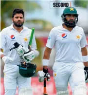  ?? — AFP ?? Pakistan’s Azhar Ali (left) and Misbah-ul Haq on Day Three of the second Test against the West Indies at the Kensington Oval in Barbados on Tuesday.