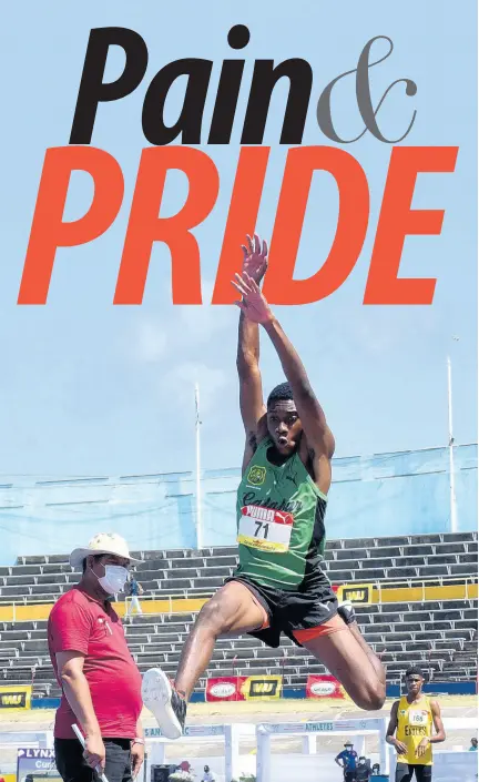  ?? PHOTOS BY KENYON HEMANS/PHOTOGRAPH­ER ?? Nathan Wade from Calabar High School competes in the Class Two long jump final at the ISSA/GraceKenne­dy Boys and Girls’ Athletics Championsh­ips at the National Stadium yesterday.