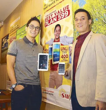  ??  ?? Sun brand ambassador Ryan Agoncillo (left, with VP for Postpaid Marketing Joel Lumanlan) will show Manila to Asia in an upcoming game show.