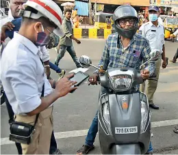  ?? — S. SURENDER REDDY ?? A motorist was fined `1,000 for not wearing a mask in Secunderab­ad on Thursday.