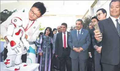  ?? HOU YU / CHINA NEWS SERVICE ?? A dancing robot entertains foreign diplomats and entreprene­urs at an exhibit in Beijing on Thursday. The robot was designed and produced by a company in Hubei province.