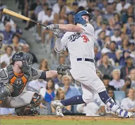  ?? Wally Skalij Los Angeles Times ?? IN A GAME that saw a World Series-record eight home runs, the Dodgers’ Joc Pederson gets in on the action with a solo shot in the fifth inning.