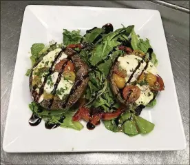  ?? CONTRIBUTE­D PHOTOS ?? The Carillon Caprese Portobello is among the items on The Dayton Club’s new menu. The restaurant used to be named the Dayton Racquet Club.