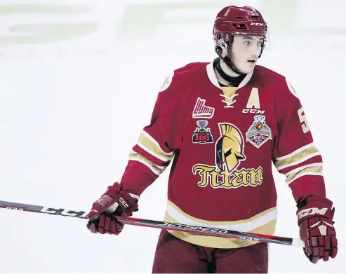  ?? — THE CANADIAN PRESS FILES ?? The Vancouver Canucks could grab Acadie-Bathurst Titan’s Noah Dobson if he is still available at the No. 7 pick in the NHL draft later this month. The defenceman’s stock has been rising because he has played with winning teams, shows great hockey...