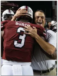  ?? (AP/Hakim Wright) ?? First-year South Carolina Coach Shane Beamer (right) was on the staff at Georgia with Sam Pittman in 2016-17 and spoke highly of the second-year Arkansas coach. “It’s not a surprise to me the success he’s having, because he’s the same guy day in, day out,” Beamer said.