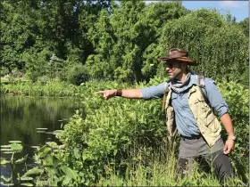  ?? ?? Nathaniel “Coyote” Peterson, American YouTuber and Wildlife educator points out common snapping turtles on the water while exploring Holden Arboretum.