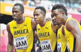  ?? AFP ?? (LR) Jamaica's Usain Bolt, Julian Forte, Michael Campbell and Tyquendo Tracey pose after winning their heat of the 4x100m relay at the IAAF World Championsh­ips in London on Friday.