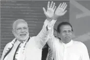  ?? AFP ?? Prime Minister Narendra Modi and Sri Lankan President Maithripal­a Sirisena wave to supporters after addressing a rally in Norwood, about 80km east of Colombo, on Friday.