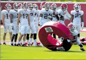  ?? NWA Democrat-Gazette/J.T. WAMPLER ?? Arkansas defensive back Kam Curl hits the tackle ring on one of the Razorbacks’ two practice fields in Fayettevil­le. Arkansas’ players and staff have enjoyed the two practice fields, with Coach Chad Morris saying, “It’ll be something that I’ll do from now on.”