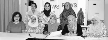  ??  ?? Norjanah (seated, centre) with her PPWS committee at the press conference.