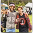  ??  ?? Oakland musician
Enon Gaines (left) and pal Andrew Arias “go bandannas” at Outside Lands.