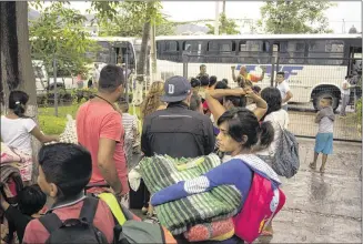  ?? CESAR RODRIGUEZ / ASSOCIATED PRESS ?? People seeking safety from Hurricane Patricia stand in line to be taken to another shelter Friday because the one at which they arrived in the resort city of Puerto Vallarta, Mexico, was full. Patricia barreled into southweste­rn Mexico Friday night as...