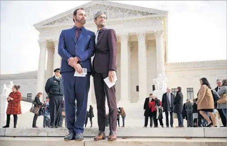  ?? Chip Somodevill­a Getty Images ?? DAVID MULLINS, left, and Charlie Craig outside the Supreme Court on Tuesday. Their dispute with a Colorado baker led to the case.