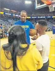  ?? PHOTO BY SHANNON PETRELLO ?? Kevin Durant catches up with Dez Frazier and Yaritza Rodriguez after spotting them in the stands. Dez says Durant “truly sees that his mission is to create a pathway for youth to just keep moving and to achieve their dreams.”