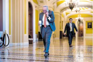  ?? AP ?? Senate Majority Leader Chuck Schumer arrives at the Capitol in Washington DC while Republican­s hold a closed-door meeting after blocking a bipartisan border package that had been tied to wartime aid for Ukraine.