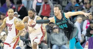  ?? STREETER LECKA/GETTY ?? The turnovers came early and often in Wednesday night’s Heat-Hornets game in Charlotte, N.C.