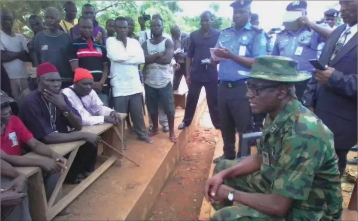  ??  ?? Major Gen. Abubakar during a peace meeting with village heads and youth leaders on land dispute between Cross River and Ebonyi States