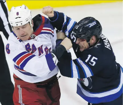  ??  ?? Thirty-six-year-old Winnipeg Jets centre Matt Hendricks, right, says he is excited that the franchise has a fighting chance at a Central Division title.