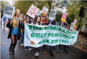  ?? FINNBARR WEBSTER ?? Protesters marching in Bristol in solidarity with those in Glasgow who are demonstrat­ing alongside the COP26 Climate Summit