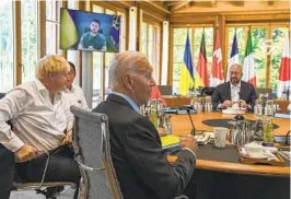  ?? KENNY HOLSTON AP ?? Ukraine President Volodymyr Zelenskyy addresses G-7 leaders, including Britain’s Prime Minister Boris Johnson and U.S. President Joe Biden, by video.