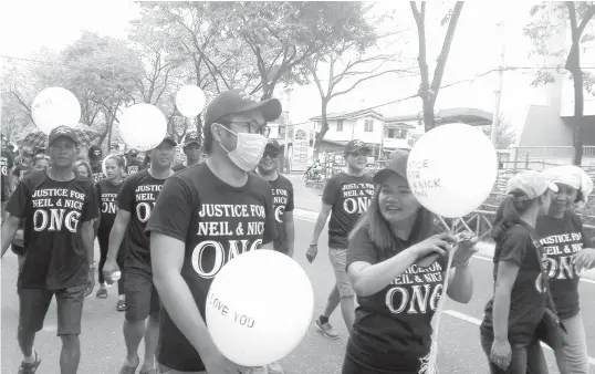  ?? FILE PHOTO ?? Friends and family of the slain brothers Neil and Nick Ong during the recent rally calling for justice for the murders.