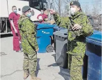  ?? RYAN REMIORZ THE CANADIAN PRESS FILE PHOTO ?? Canadian Armed Forces personnel arrive at the Villa Val des Arbes seniors residence in Laval, Que., in April.